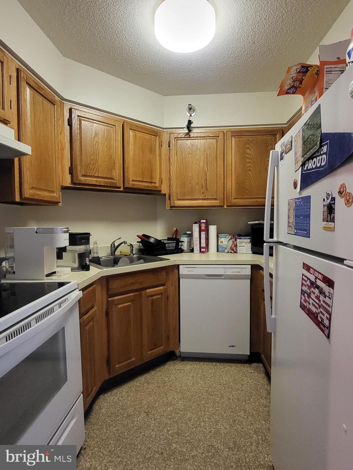 2020 Walnut Street, Unit 22A Philadelphia, PA 19103 - Photo 4 of 22 a kitchen with stainless steel appliances granite countertop a refrigerator sink and cabinets