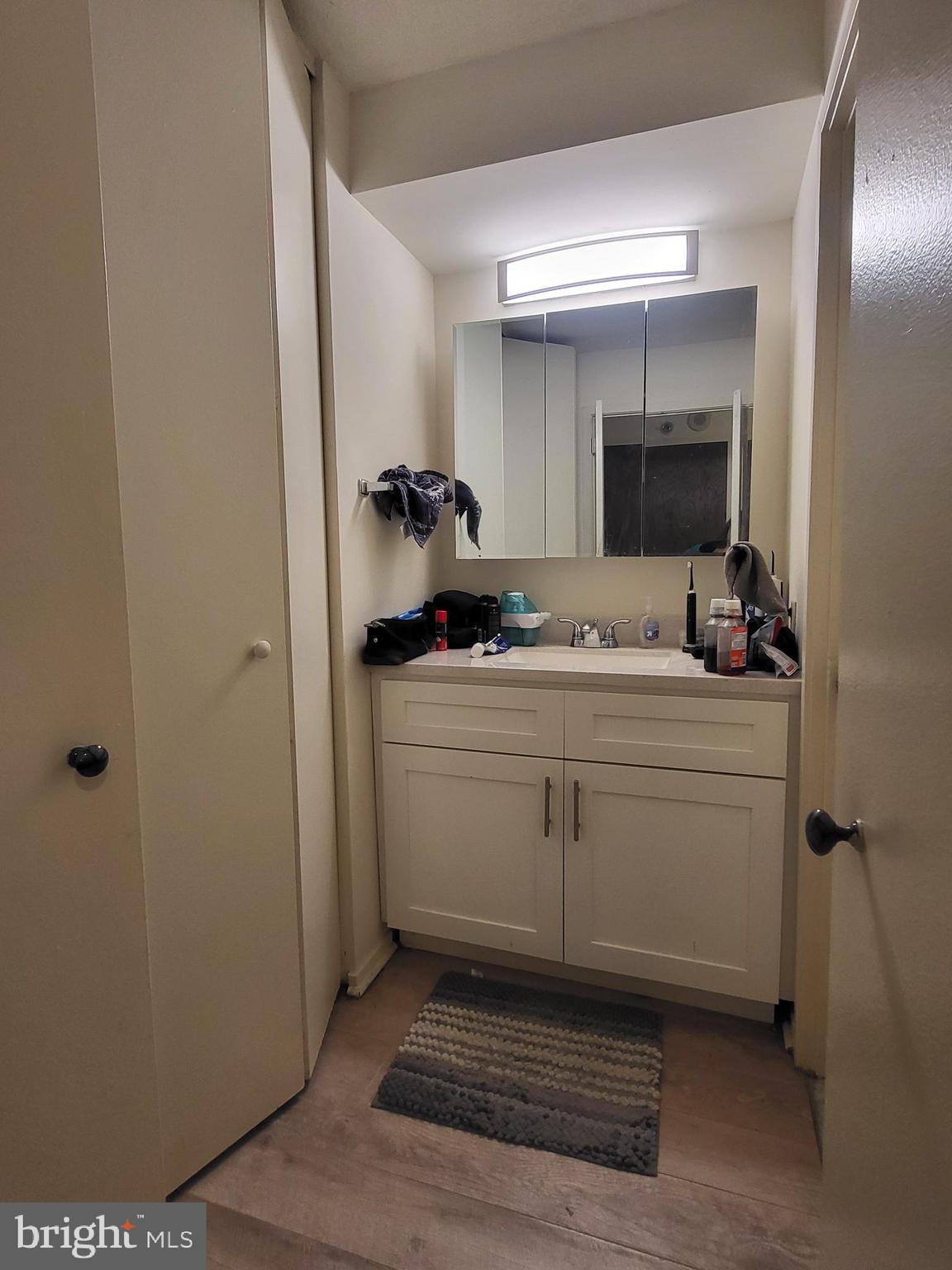 2020 Walnut Street, Unit 22A Philadelphia, PA 19103 - Photo 6 of 22 a bathroom with a sink and a mirror