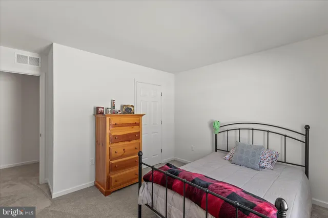 a bedroom with a bed and a cabinets