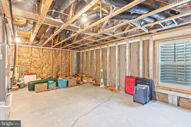 a bed room with a bed and a chandelier