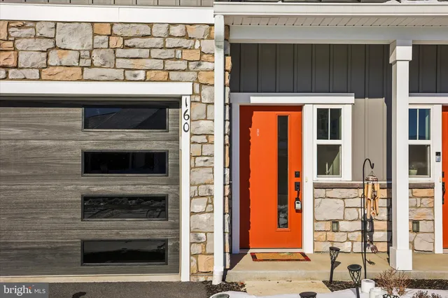 a stove top oven sitting inside of a kitchen