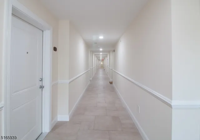 a kitchen with stainless steel appliances granite countertop a refrigerator sink and stove