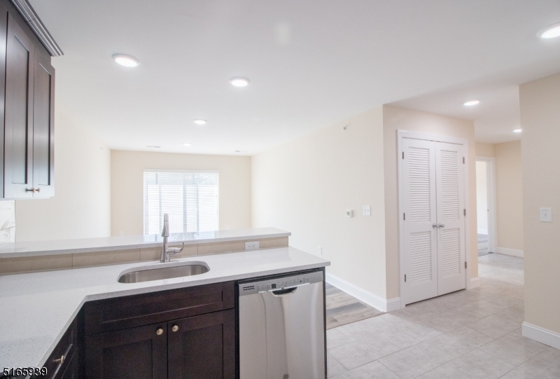 1664 Stuyvesant Avenue, Unit 306 Union, NJ 07083 - Photo 7 of 22 a bathroom with a sink and a mirror