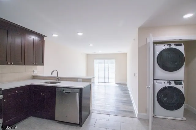 a hallway with a sink and a hard wood floor