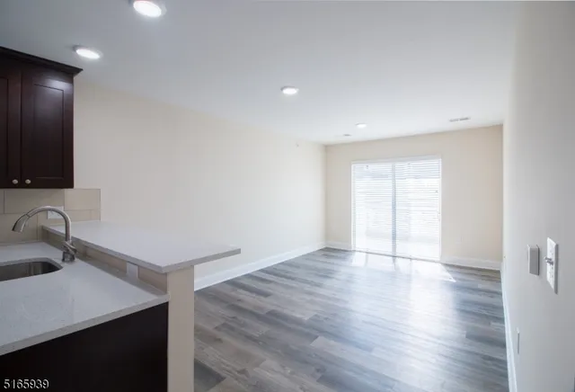 a view of kitchen with wooden floor
