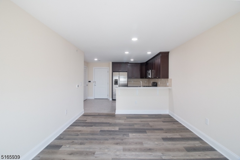 1664 Stuyvesant Avenue, Unit 306 Union, NJ 07083 - Photo 10 of 22 a view of kitchen with wooden floor