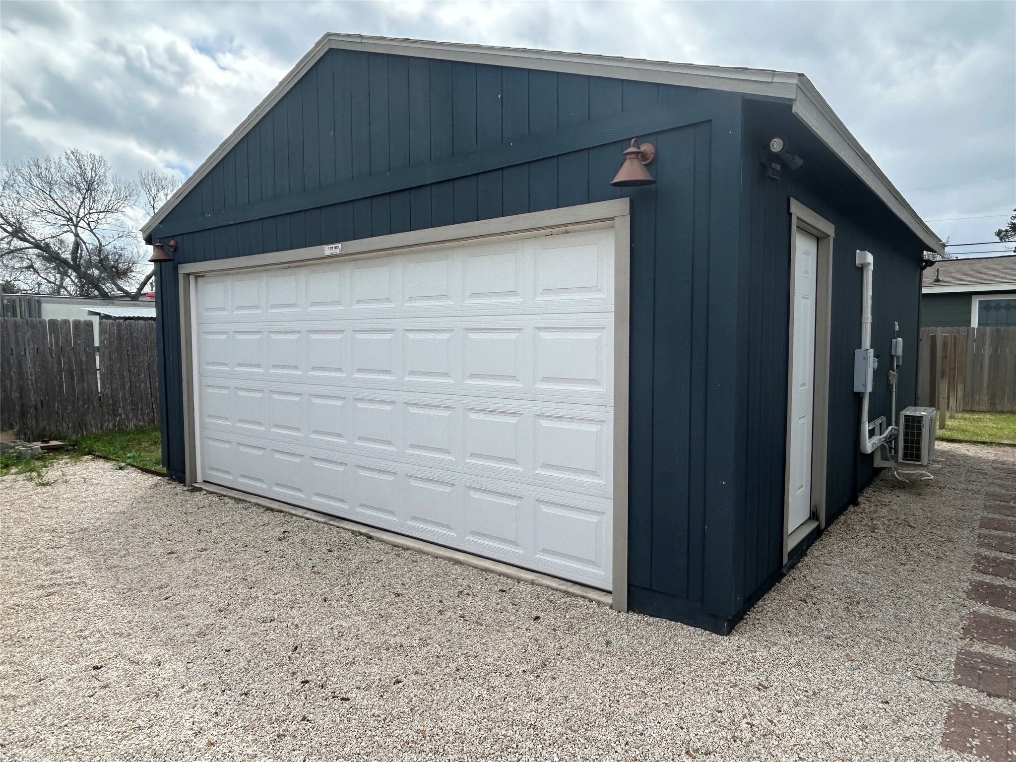 7803 Watson Street Austin, TX 78757 - Photo 29 of 30 Two car garage that has electric, two doors, windows and a mini split. Could be used as an office/studio/gym.