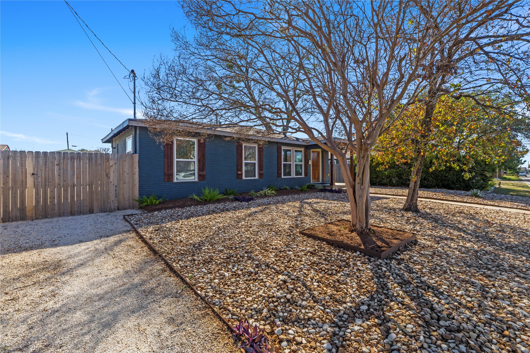 7803 Watson Street Austin, TX 78757 - Photo 4 of 30 Driveway with gated entry to backyard.
