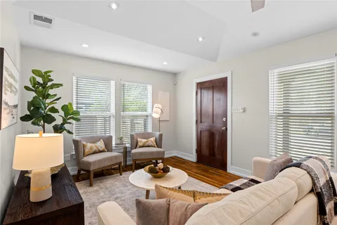 a bedroom with furniture and a window