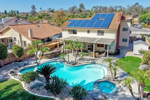 an aerial view of a house with garden space and houses view