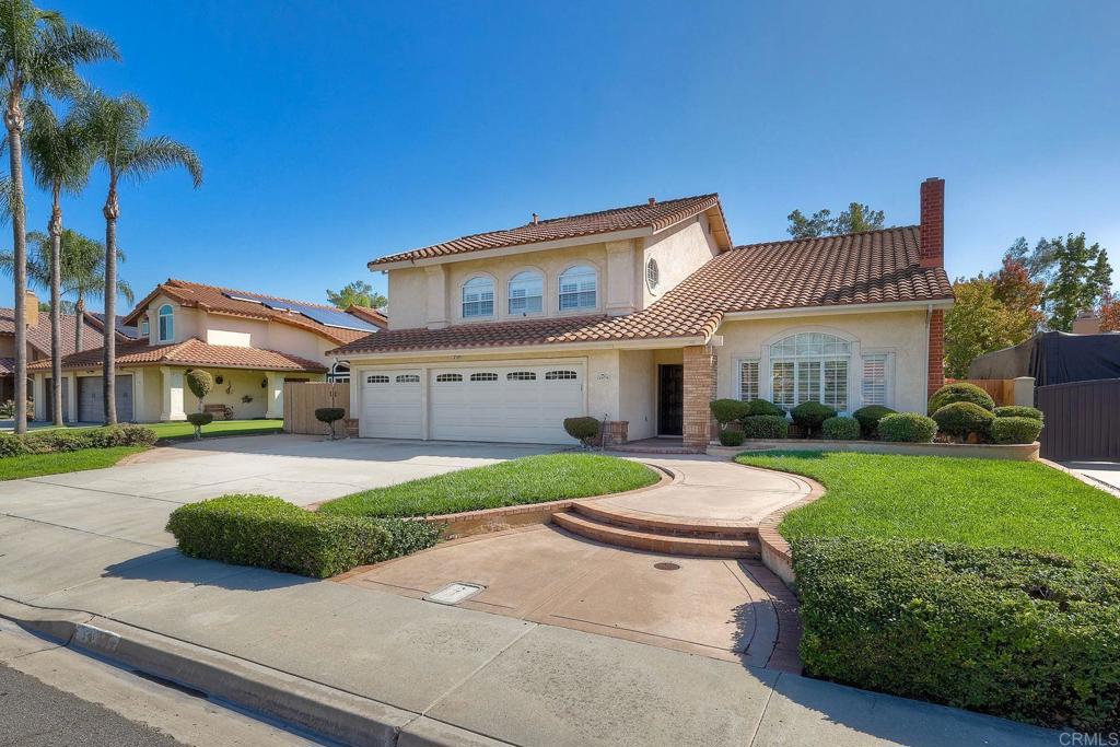 13979 Hickory Street Poway, CA 92064 - Photo 2 of 37 a front view of a house with a yard and porch