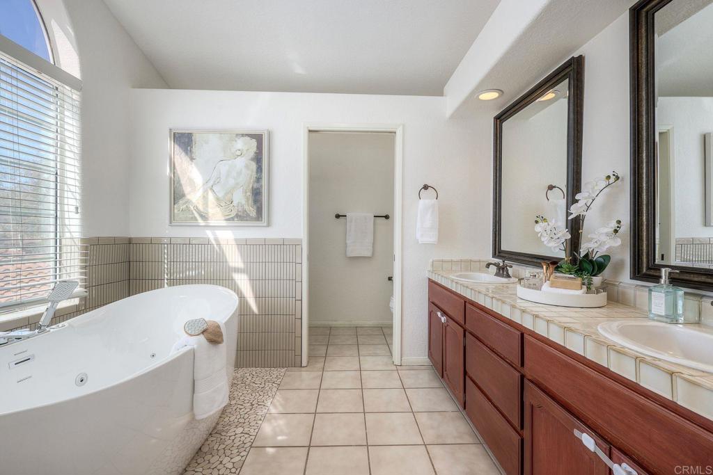 13979 Hickory Street Poway, CA 92064 - Photo 24 of 37 a bathroom with a bathtub sink and toilet