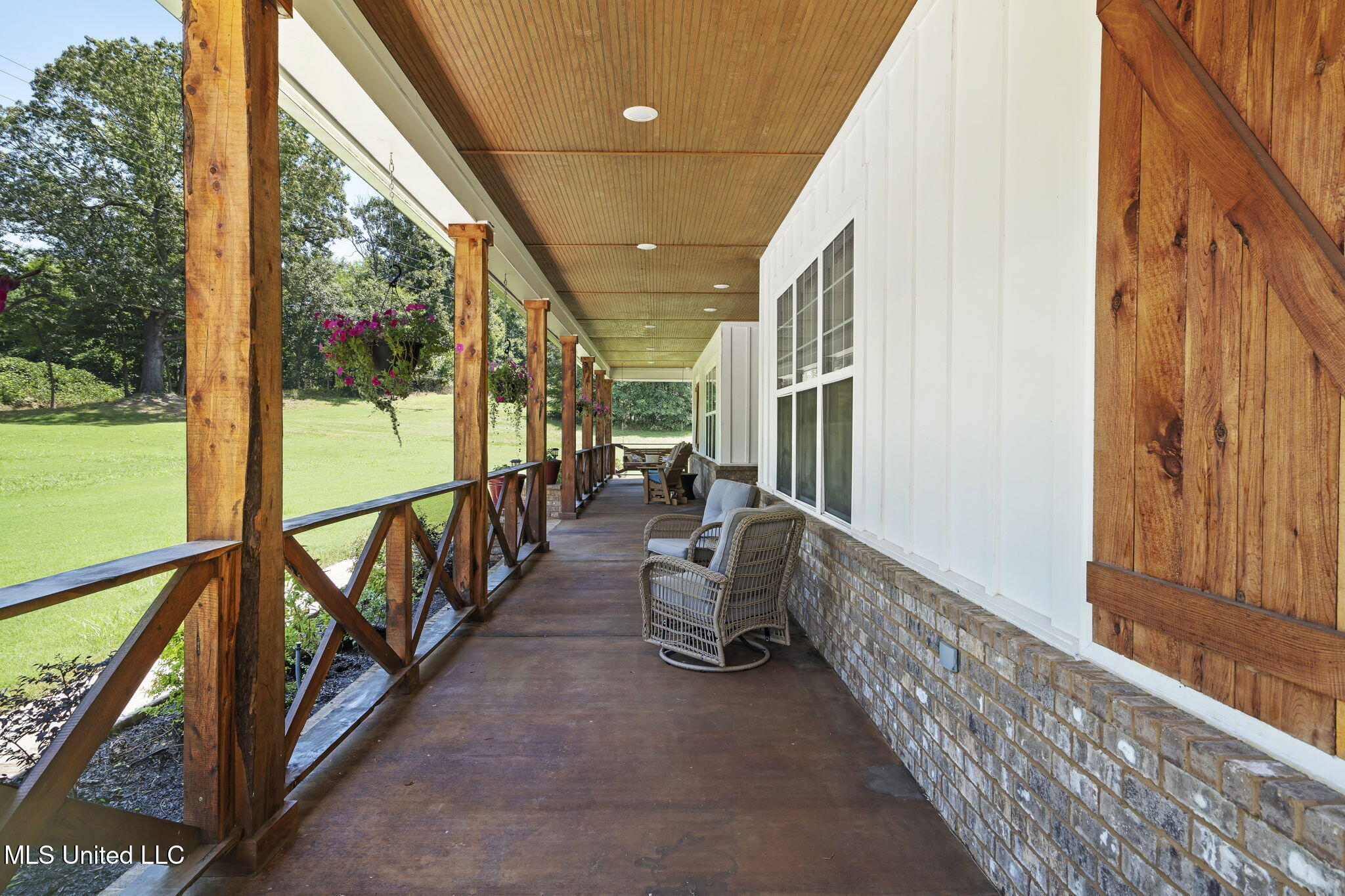 12097 Old Byhalia Road Byhalia, MS 38611 - Photo 19 of 85 large front porch with swing