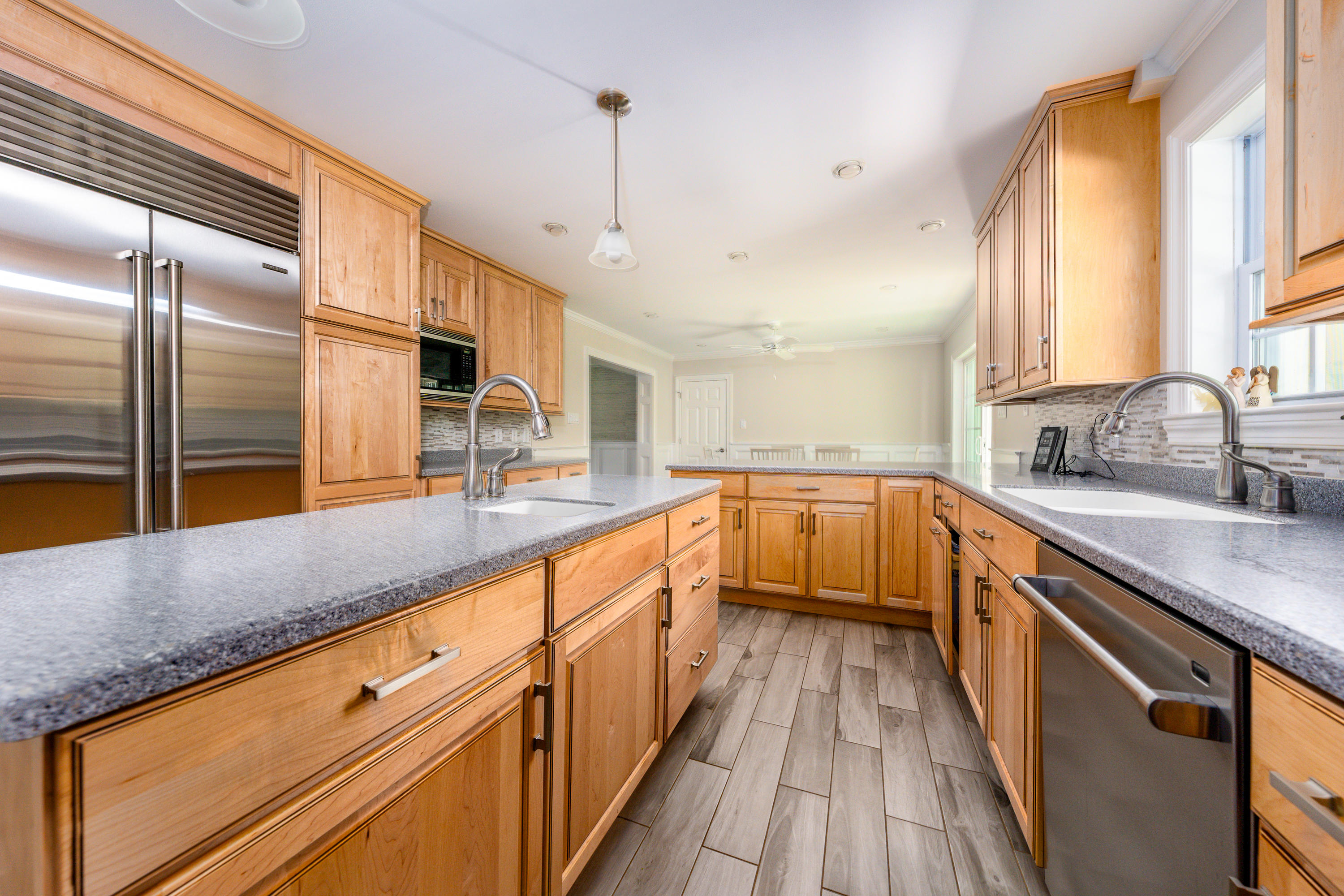 52 Pleasant Bay Road Harwich, MA 02645 - Photo 11 of 43 a view of a kitchen with a large window