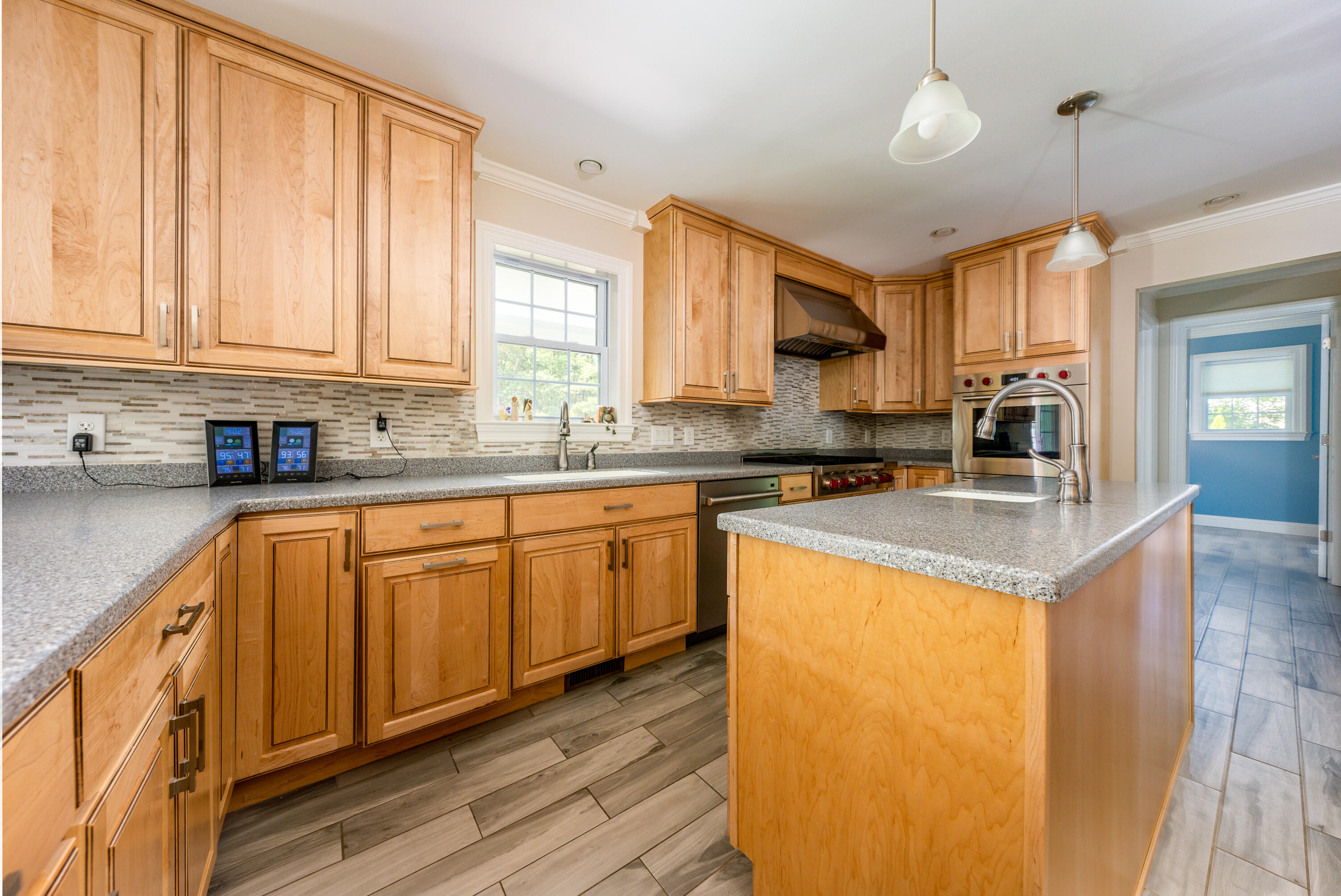 52 Pleasant Bay Road Harwich, MA 02645 - Photo 13 of 43 a kitchen with stainless steel appliances granite countertop a sink a stove and cabinets