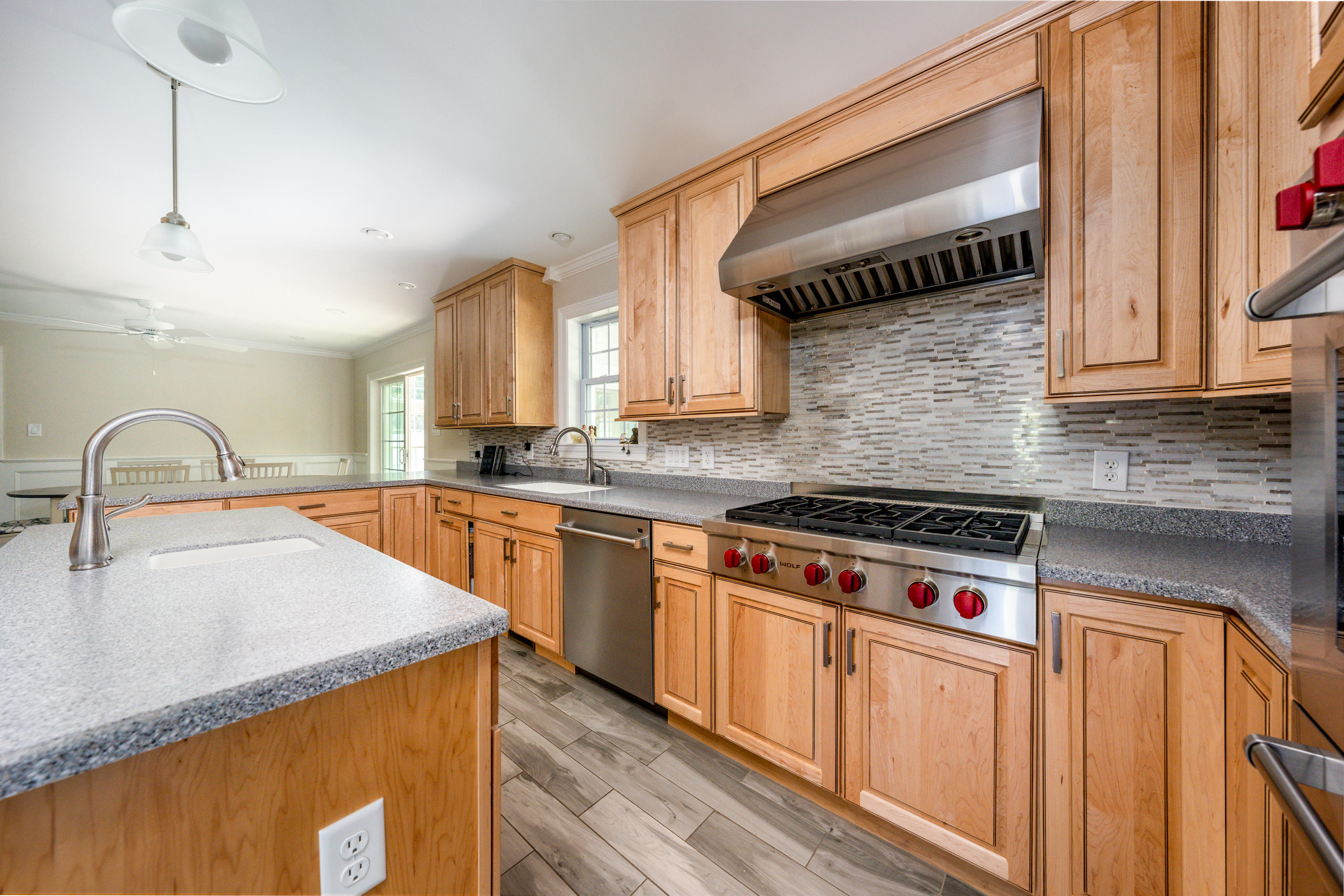 52 Pleasant Bay Road Harwich, MA 02645 - Photo 14 of 43 a kitchen with granite countertop a stove a sink and a microwave