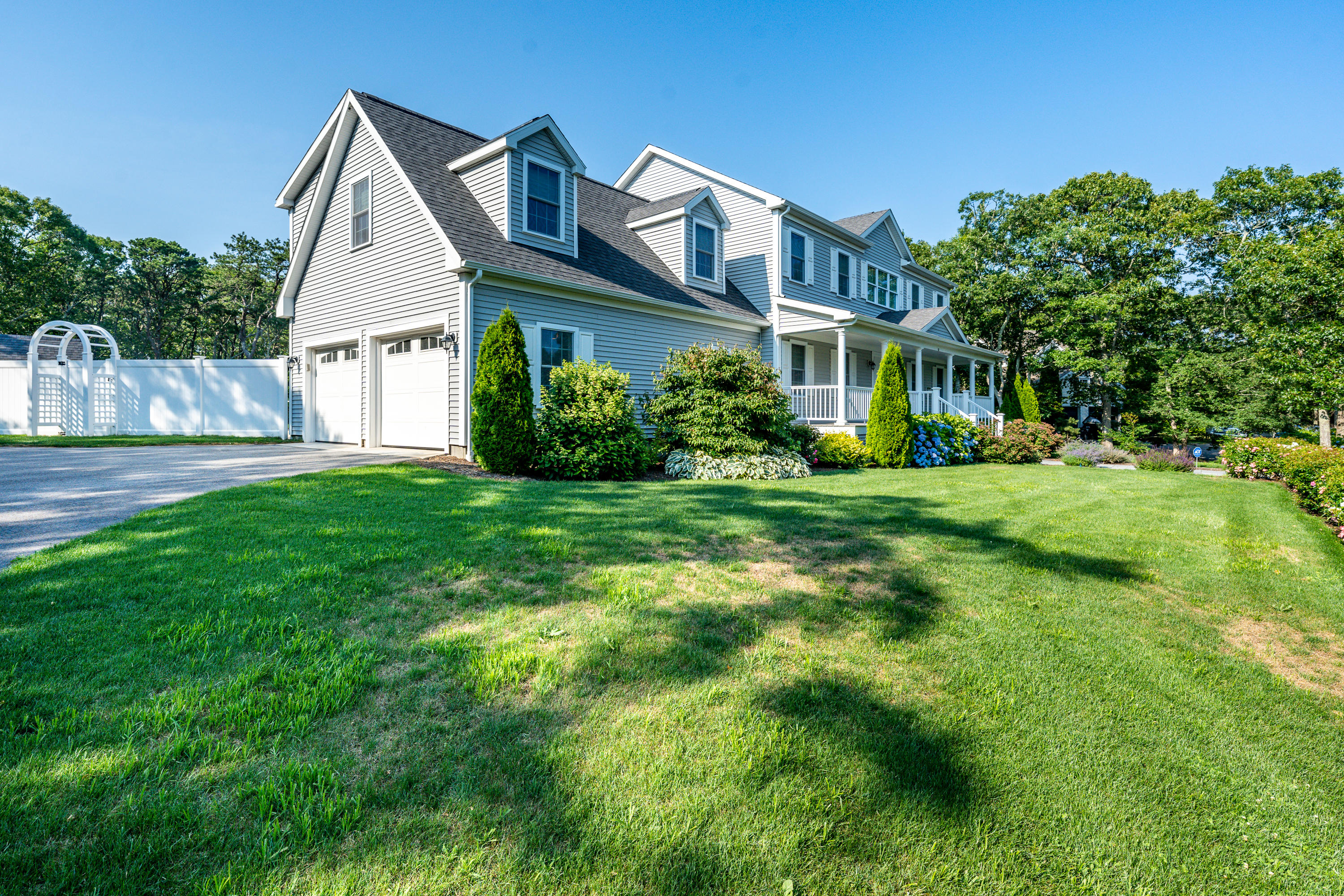 52 Pleasant Bay Road Harwich, MA 02645 - Photo 2 of 43 a front view of house with yard and green space