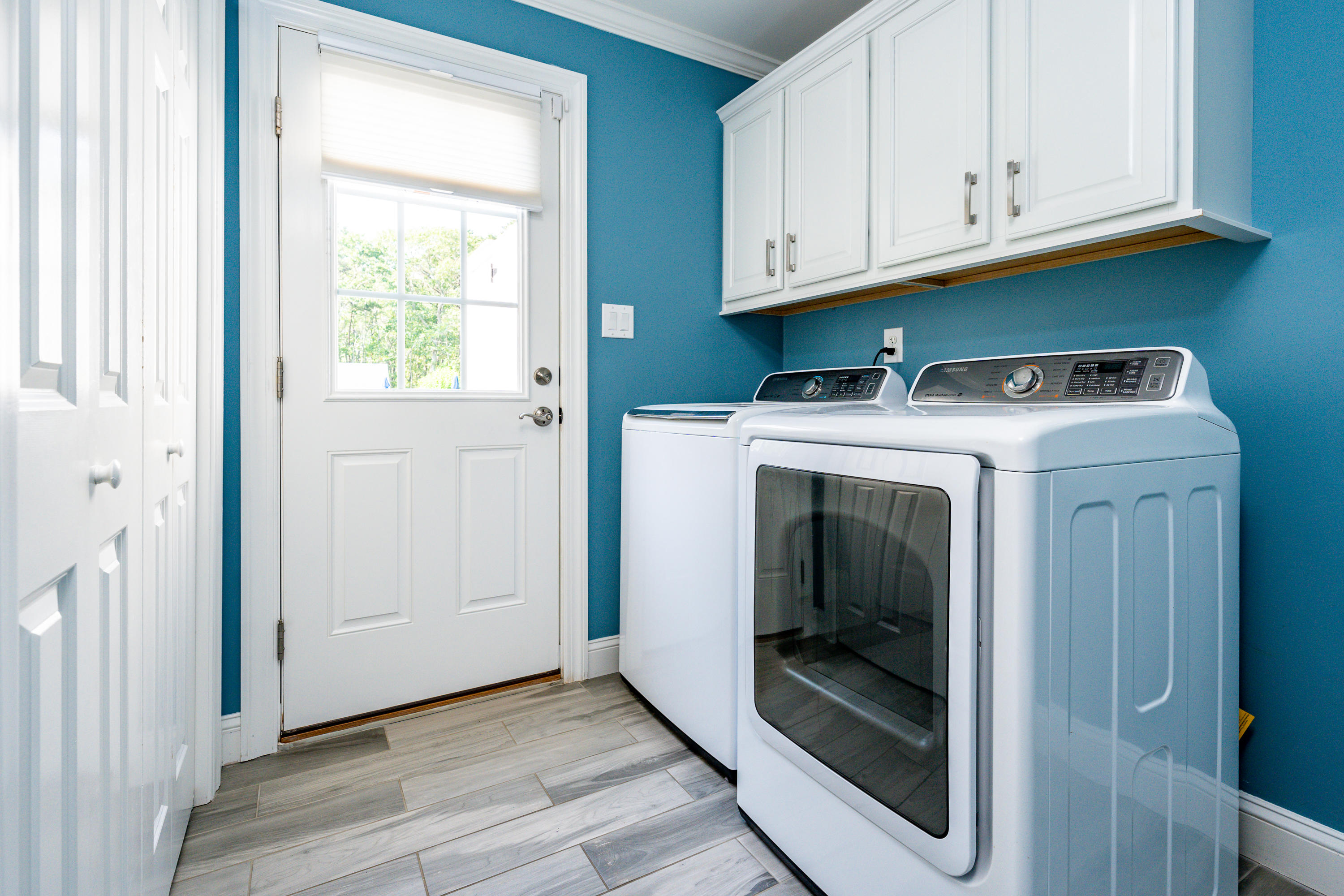 52 Pleasant Bay Road Harwich, MA 02645 - Photo 21 of 43 a utility room with wooden floor washer and dryer