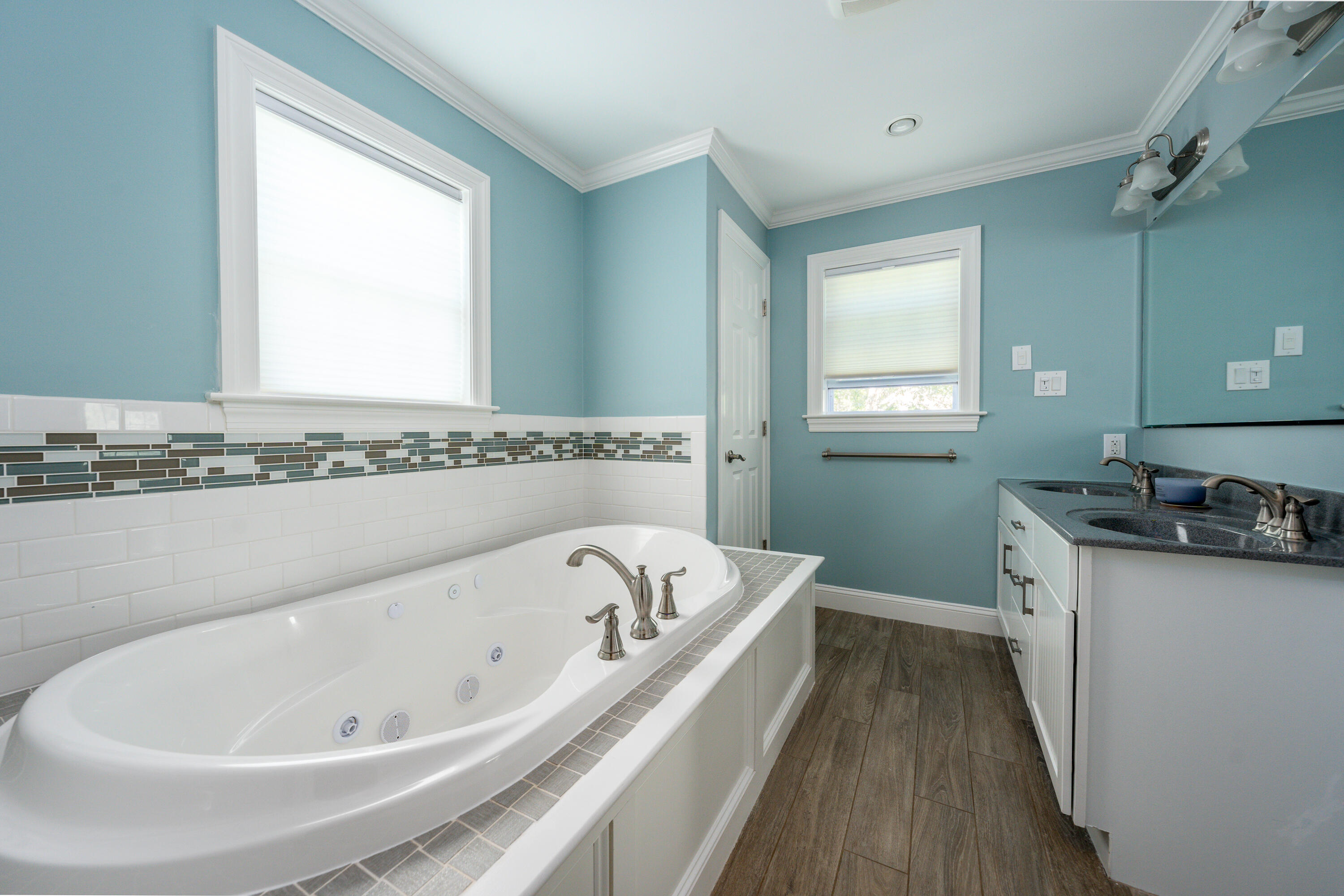 52 Pleasant Bay Road Harwich, MA 02645 - Photo 28 of 43 a spacious bathroom with a bathtub and a sink