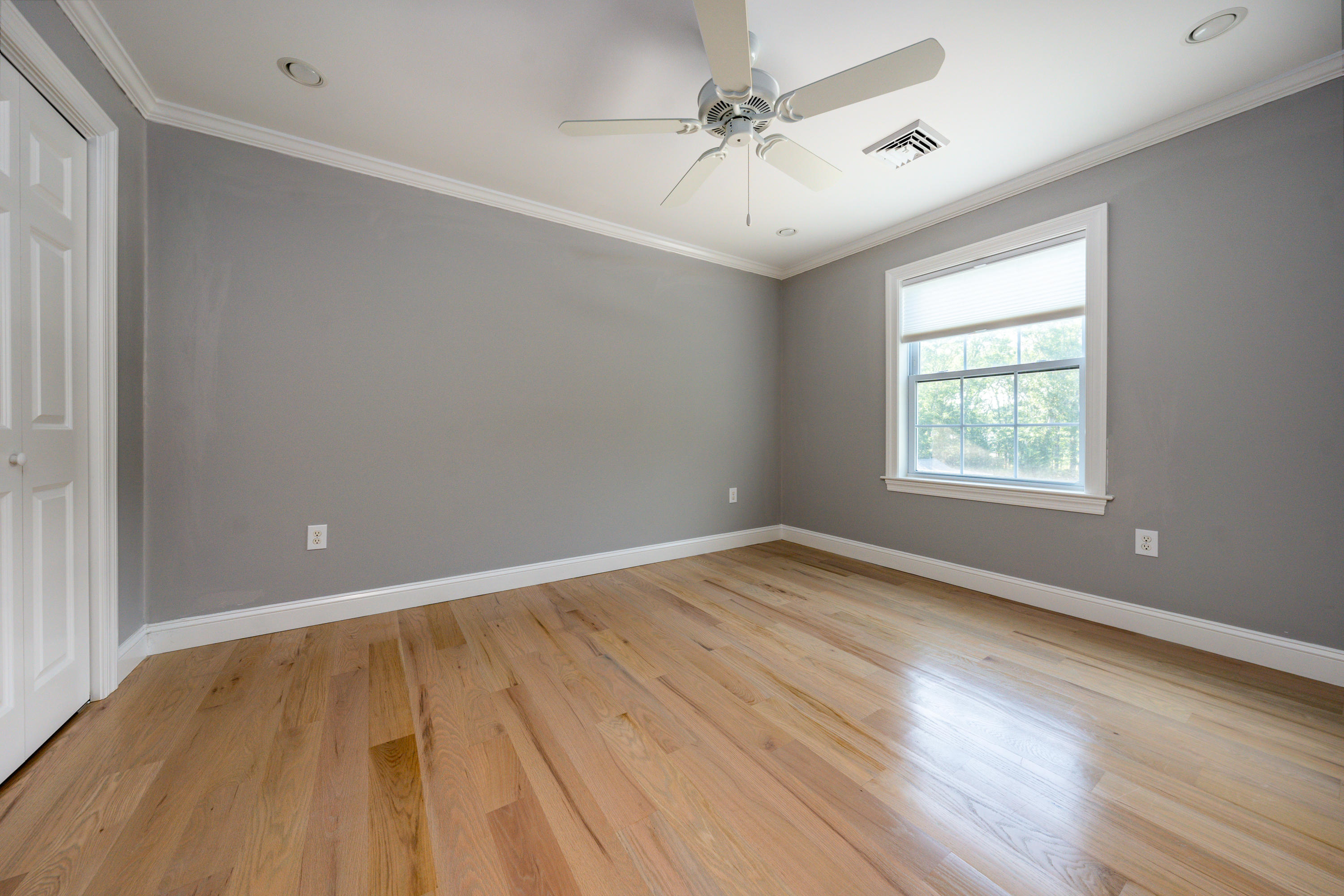 52 Pleasant Bay Road Harwich, MA 02645 - Photo 32 of 43 a view of an empty room with wooden floor and a window