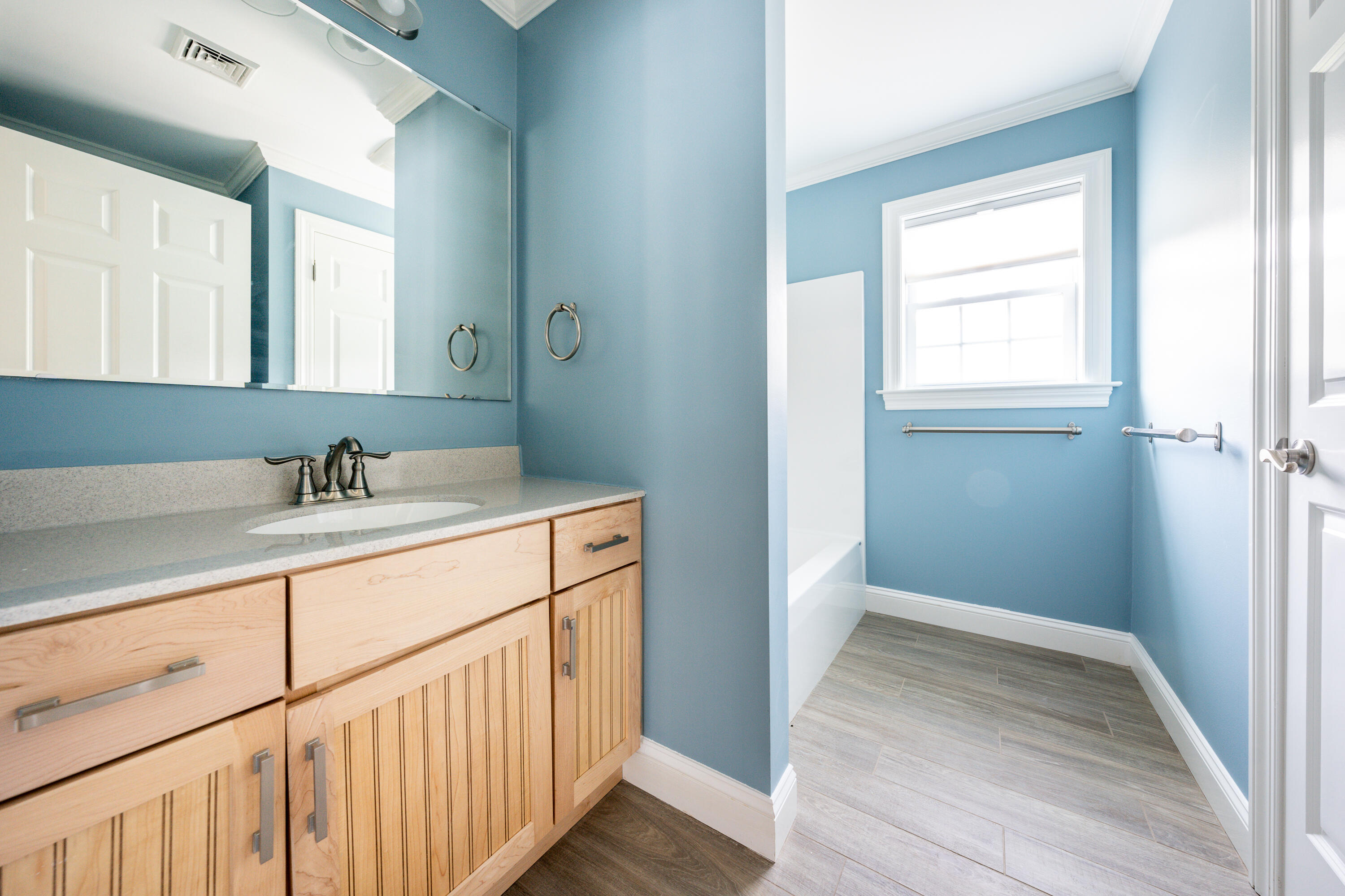 52 Pleasant Bay Road Harwich, MA 02645 - Photo 34 of 43 a bathroom with a sink a mirror and a window