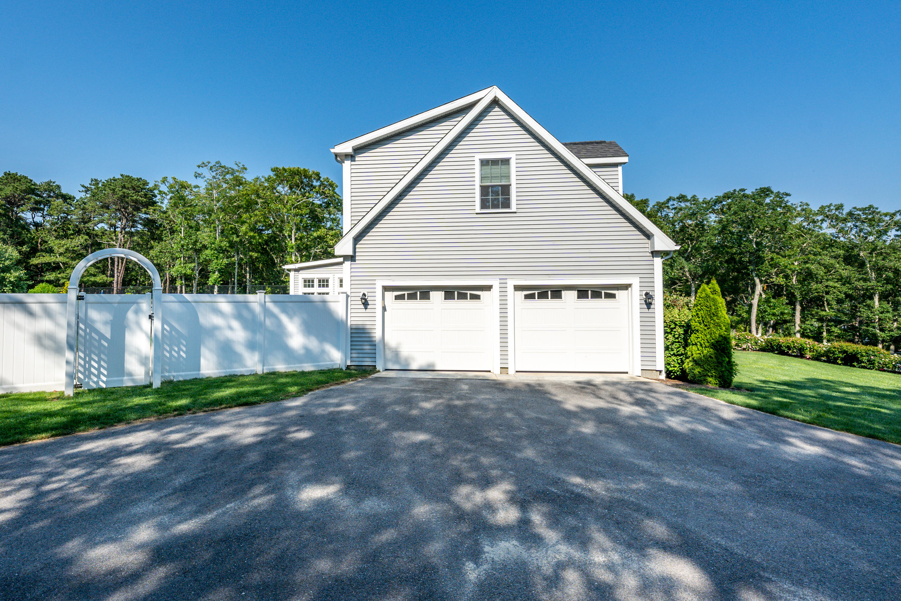 52 Pleasant Bay Road Harwich, MA 02645 - Photo 41 of 43 a view of a house with a yard and large tree