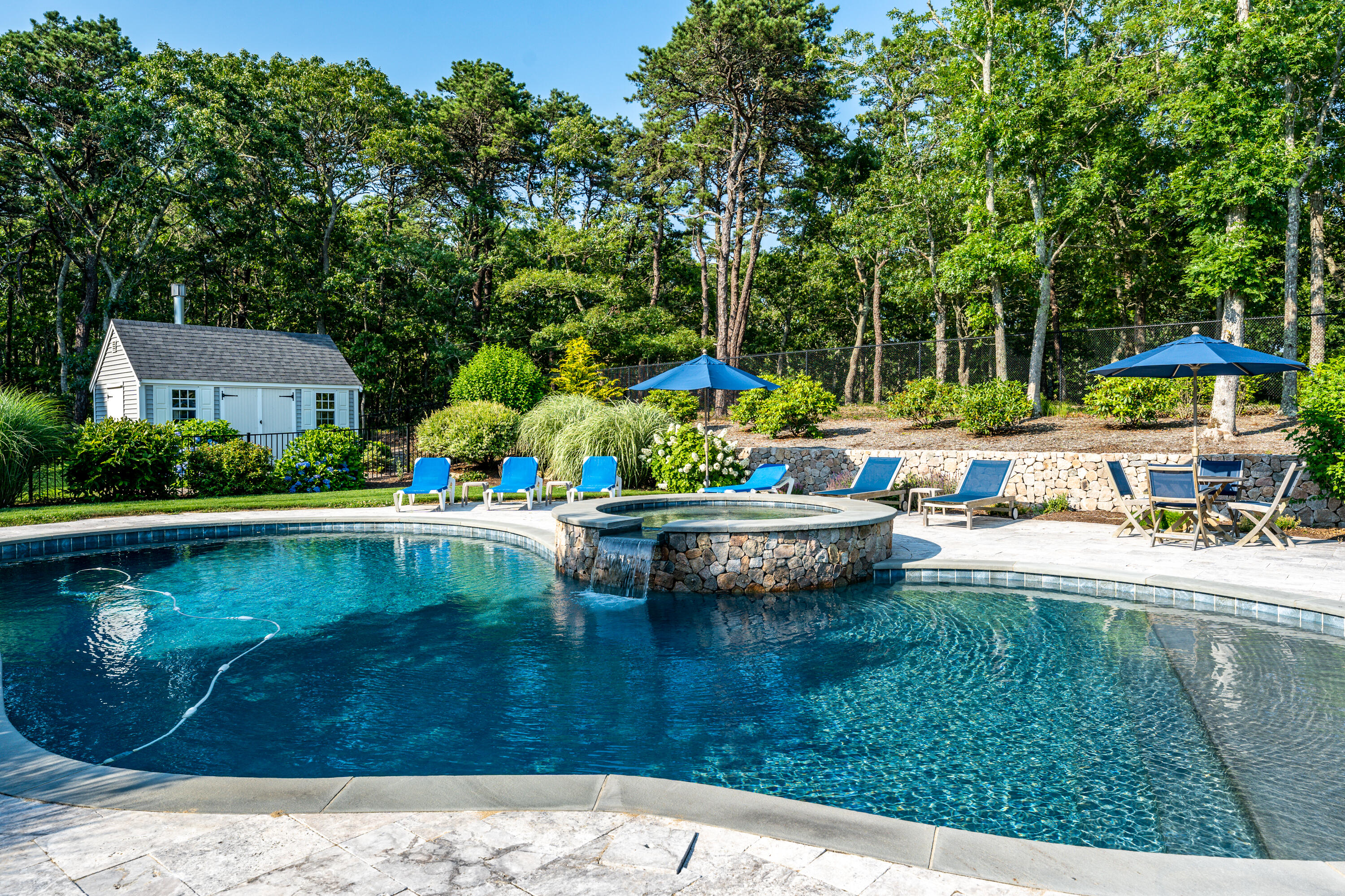 52 Pleasant Bay Road Harwich, MA 02645 - Photo 5 of 43 a view of swimming pool with lawn chairs and plants