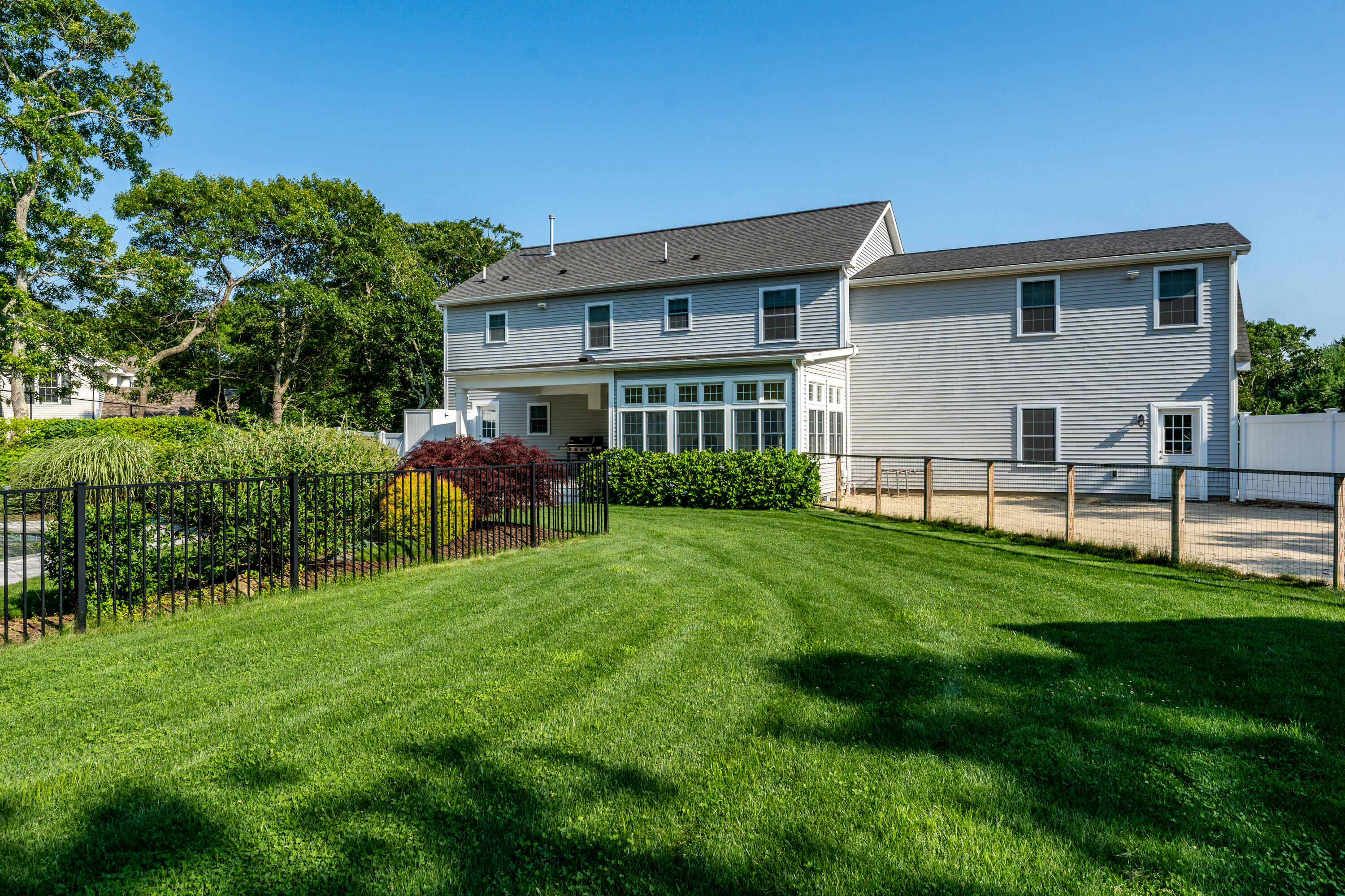 52 Pleasant Bay Road Harwich, MA 02645 - Photo 8 of 43 a view of a house with a yard porch and sitting area