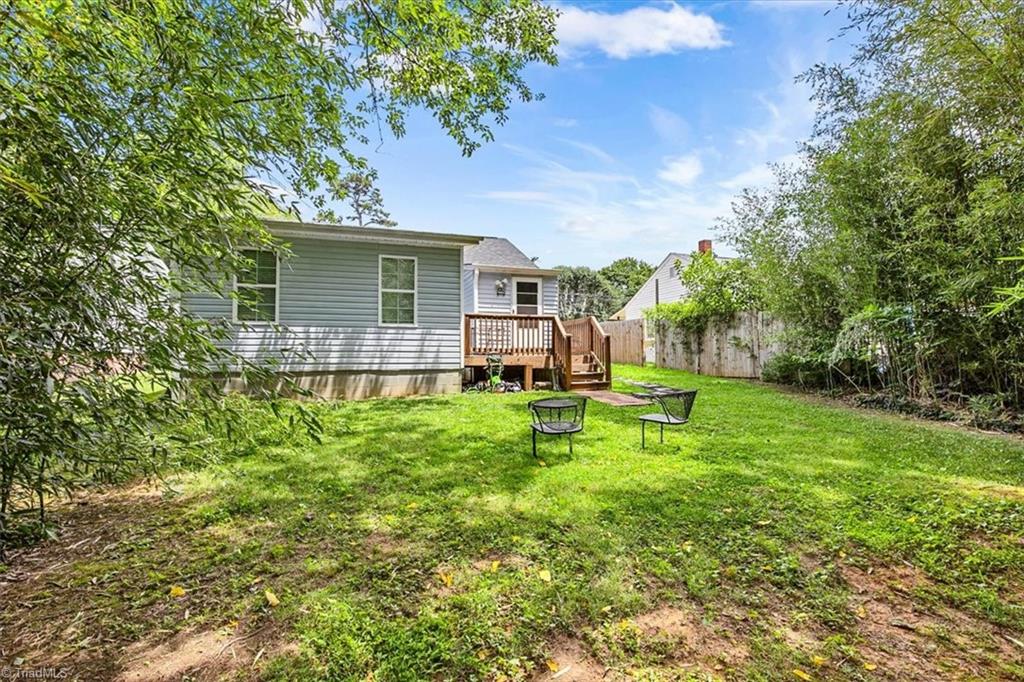 226 Friendly Avenue High Point, NC 27260 - Photo 35 of 38 A wooden deck off the back of the home offers a simple, functional outdoor space.