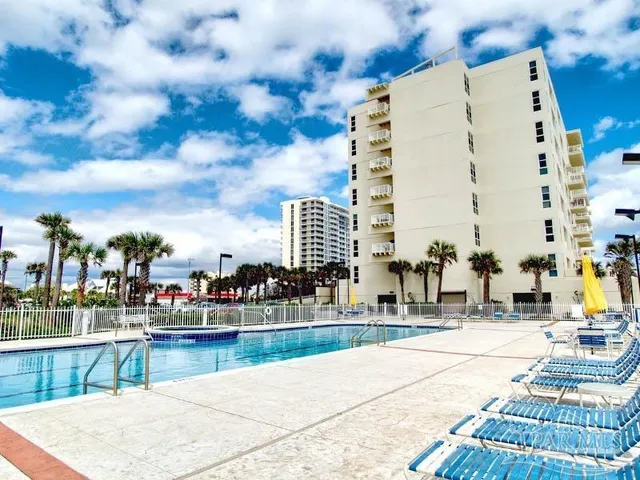 a terrace with outdoor seating and city view