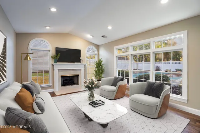 a living room with furniture and a fireplace