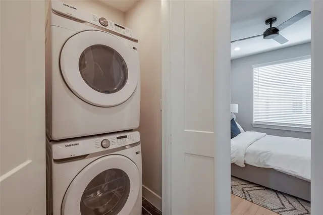 a bedroom with a washer and dryer