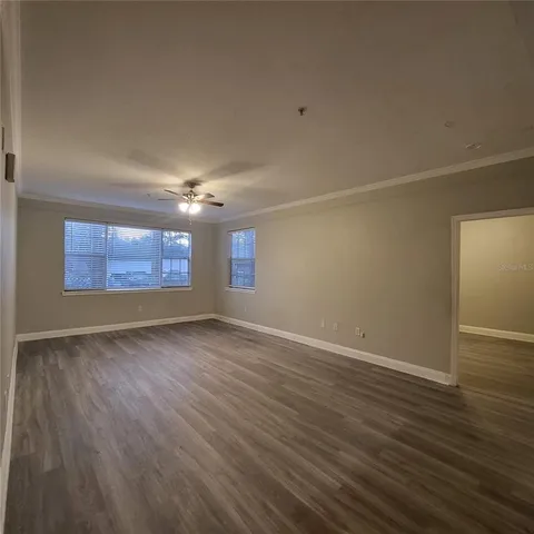 a view of a room with shelf on the wall