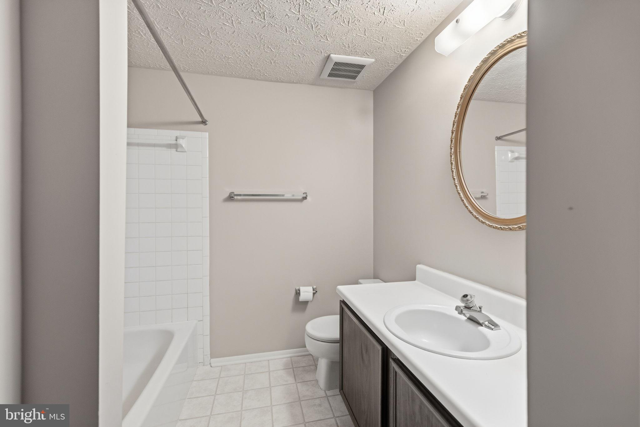 11563 Ivy Bush Court Reston, VA 20191 - Photo 11 of 48 a bathroom with a sink and a mirror