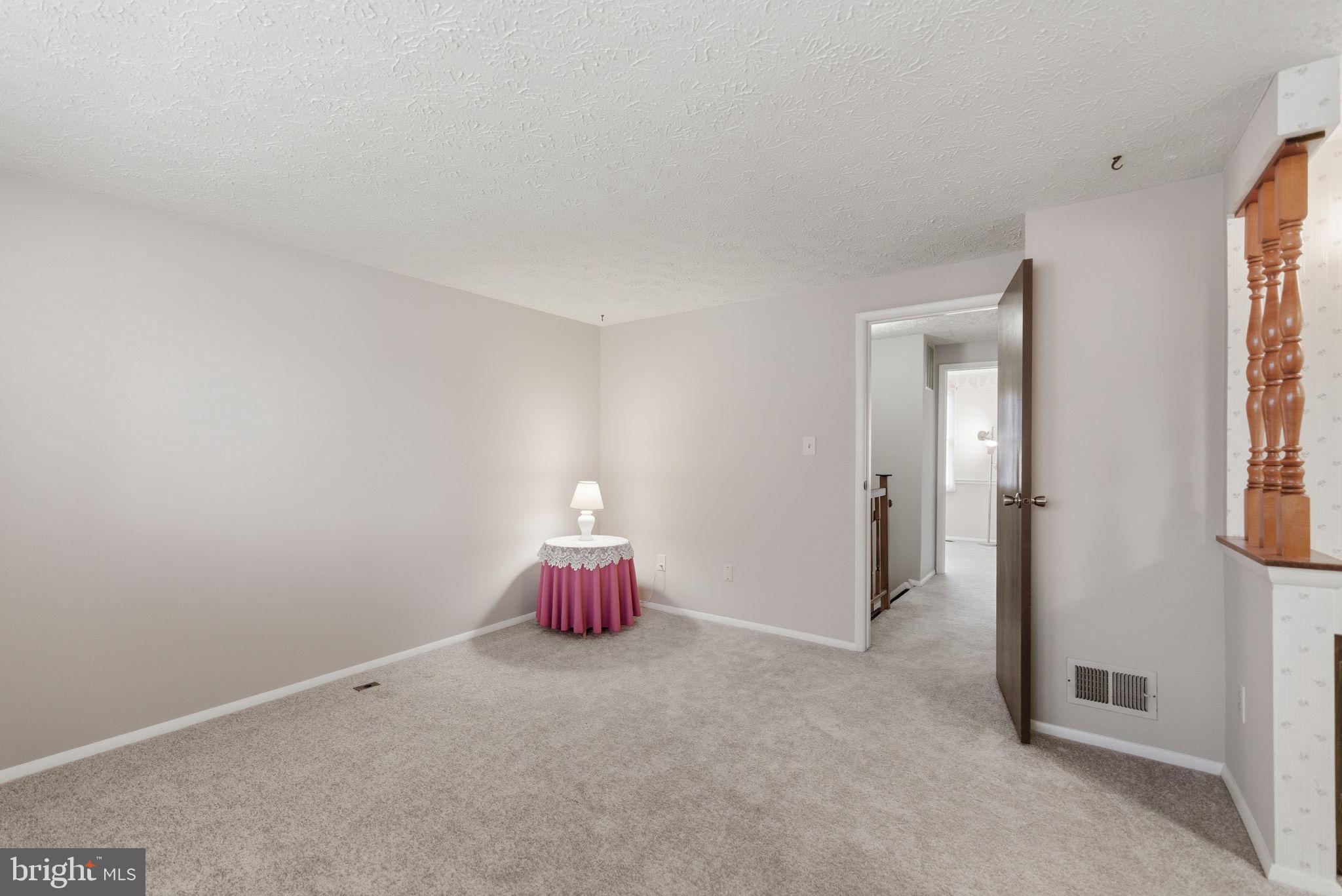 11563 Ivy Bush Court Reston, VA 20191 - Photo 13 of 48 a view of a room with wooden floor and windows