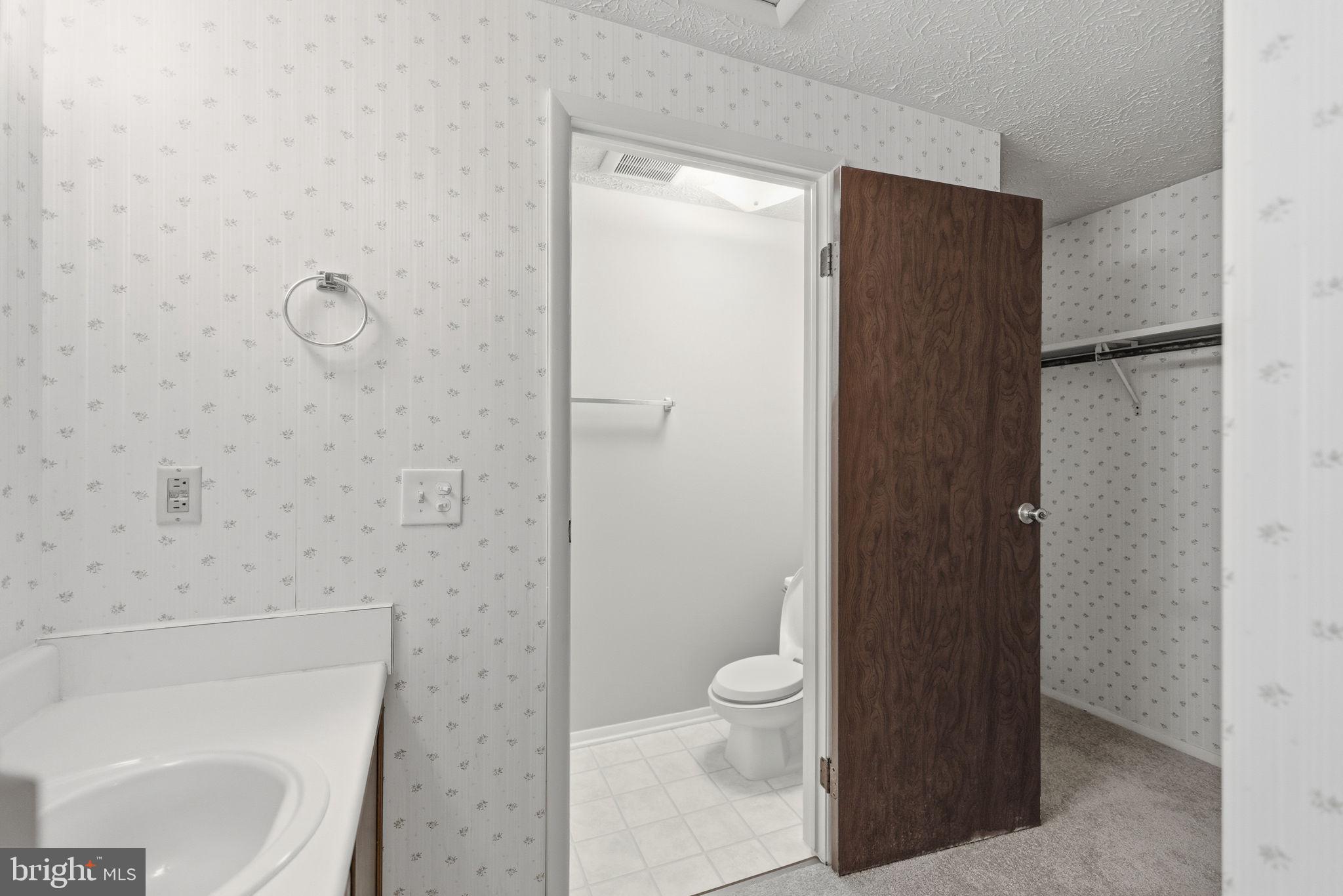11563 Ivy Bush Court Reston, VA 20191 - Photo 14 of 48 a bathroom with a toilet and a shower