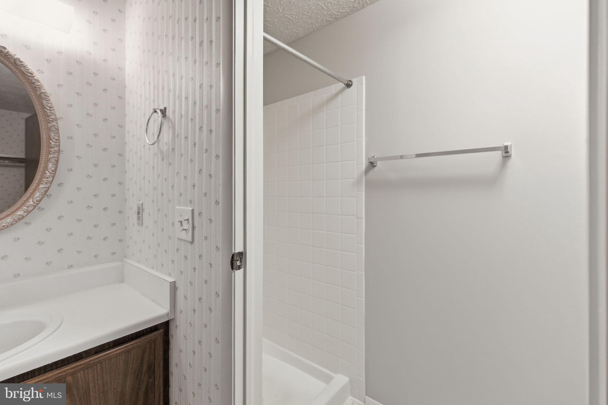 11563 Ivy Bush Court Reston, VA 20191 - Photo 15 of 48 a bathroom with a granite countertop sink and a mirror