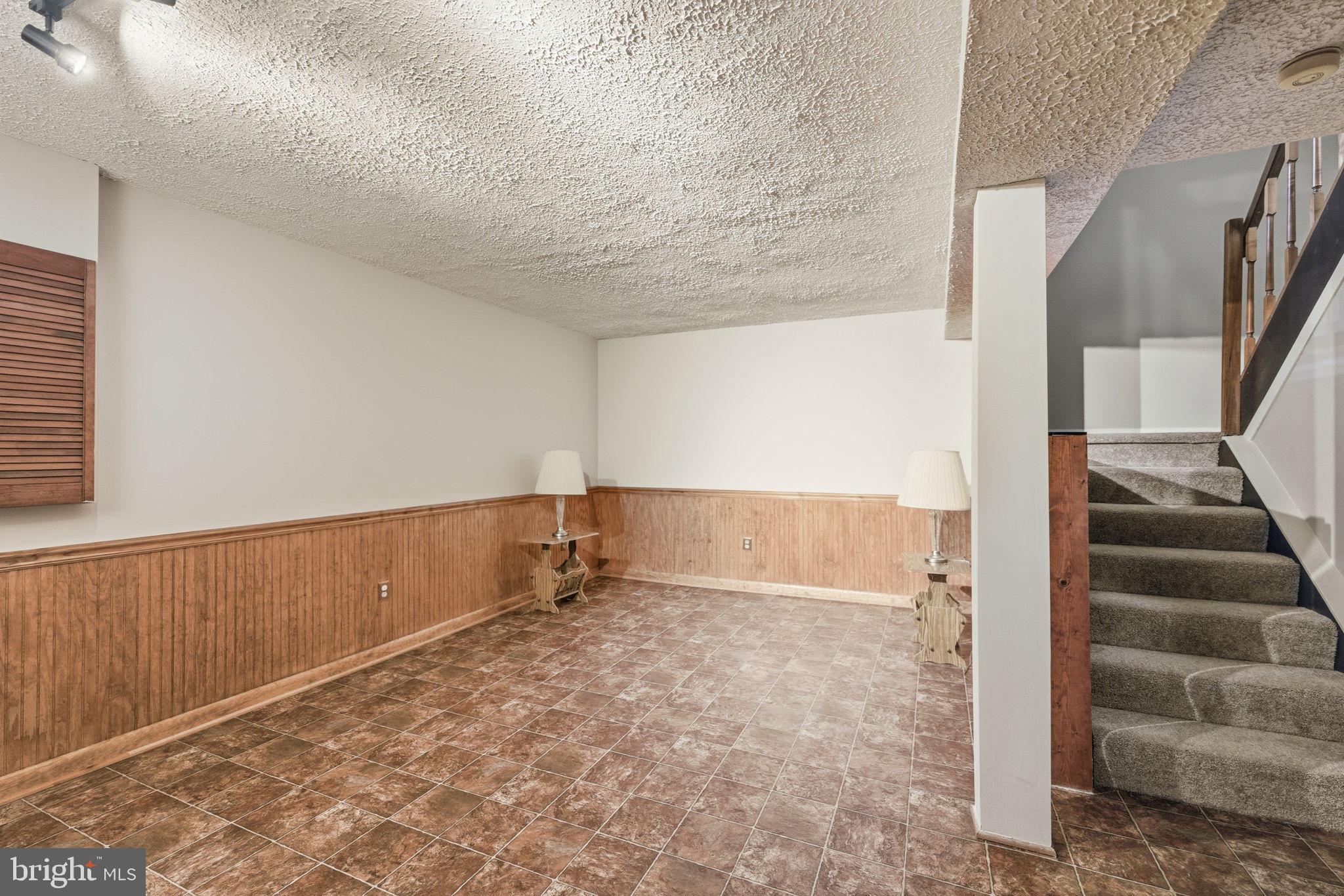 11563 Ivy Bush Court Reston, VA 20191 - Photo 16 of 48 a view of an empty room with stairs