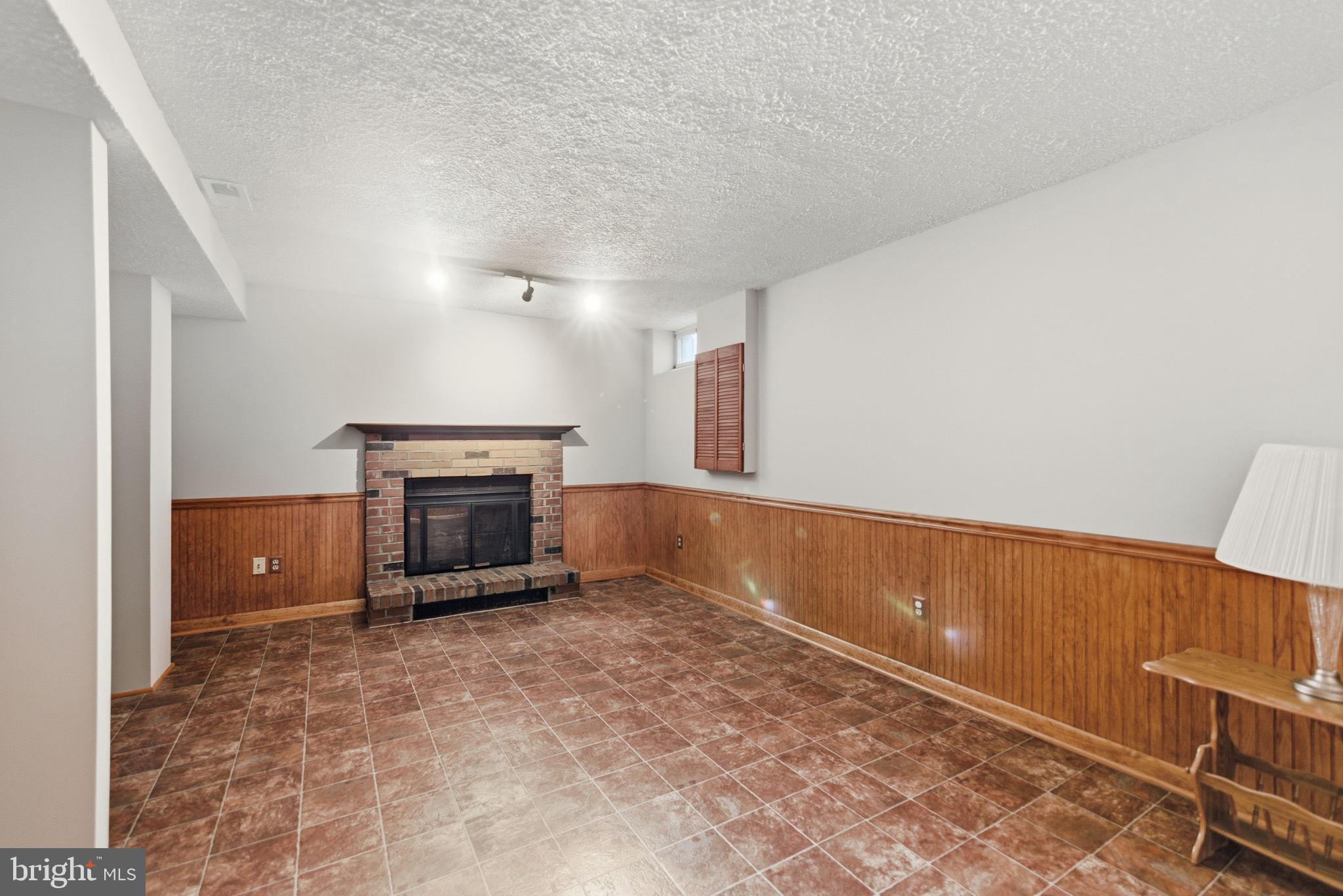 11563 Ivy Bush Court Reston, VA 20191 - Photo 17 of 48 a view of an empty room with a fireplace