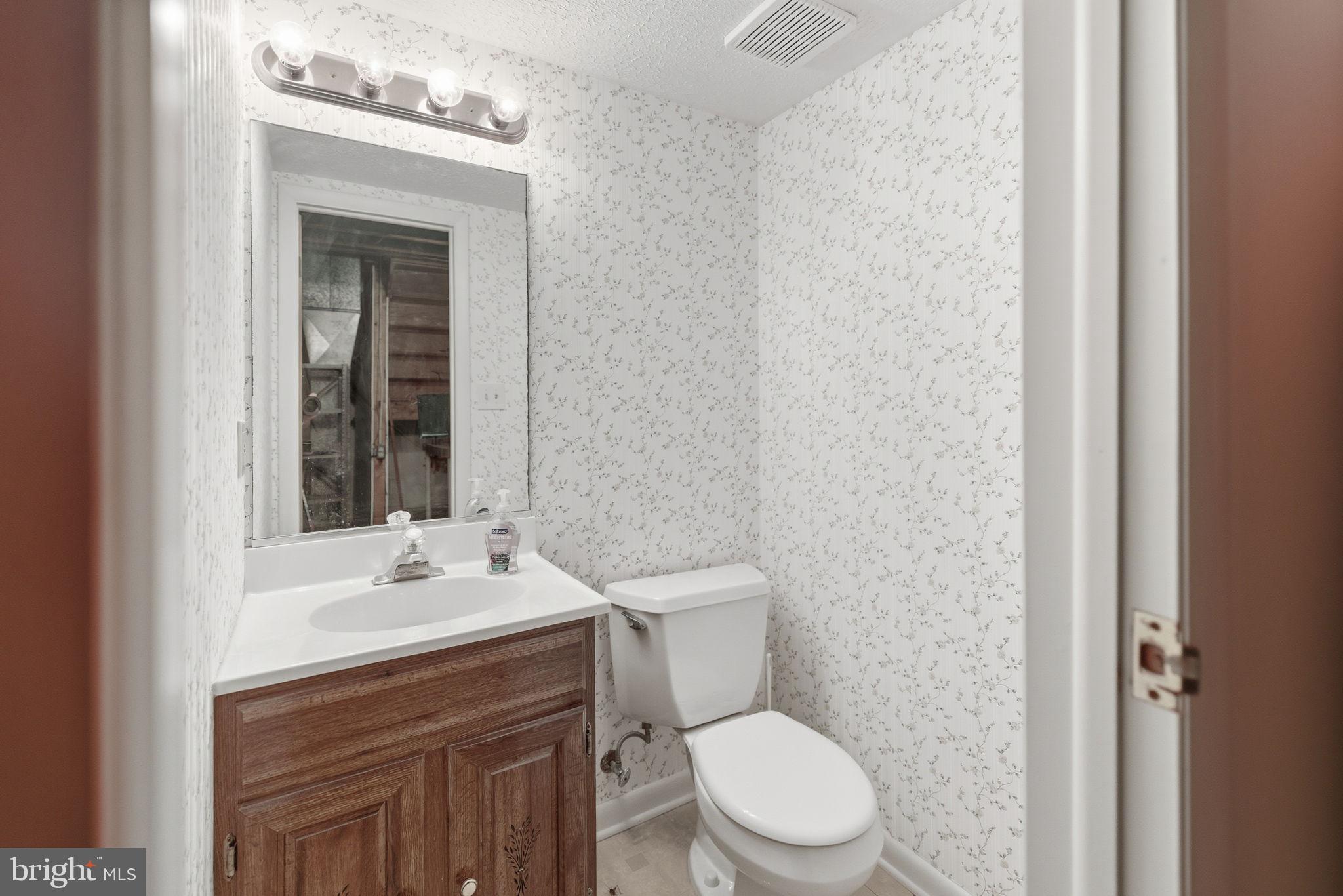 11563 Ivy Bush Court Reston, VA 20191 - Photo 21 of 48 a bathroom with a sink a toilet and shower