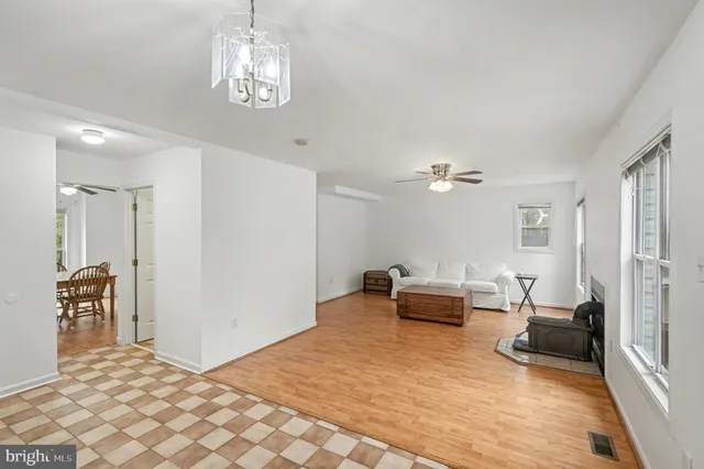 a bedroom with furniture and wooden floor