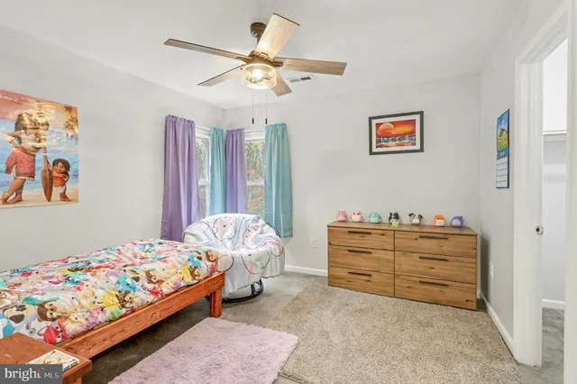 a bed room with a bed and a baby bed