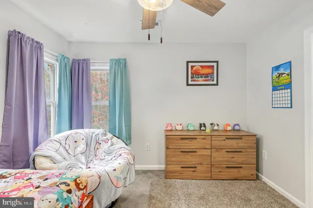 a bedroom with a bed and with furniture