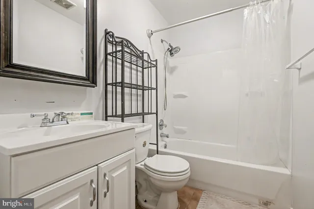 a bathroom with a sink a toilet and a bathtub