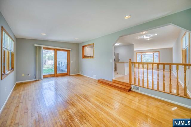 23 Smith Court Closter, NJ 07624 - Photo 11 of 23 a view of an empty room with wooden floor and a window