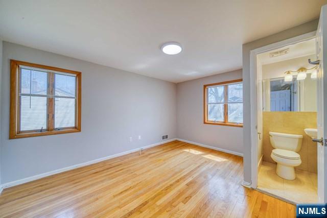 23 Smith Court Closter, NJ 07624 - Photo 15 of 23 a view of an empty room with a window and wooden floor