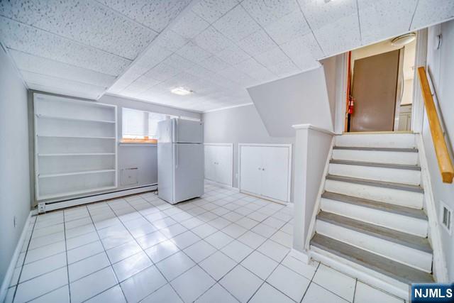 23 Smith Court Closter, NJ 07624 - Photo 21 of 23 a view of an empty room with stairs and a window