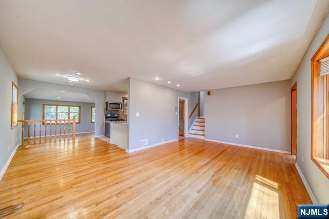 23 Smith Court Closter, NJ 07624 - Photo 7 of 23 a view of an empty room with window and wooden floor