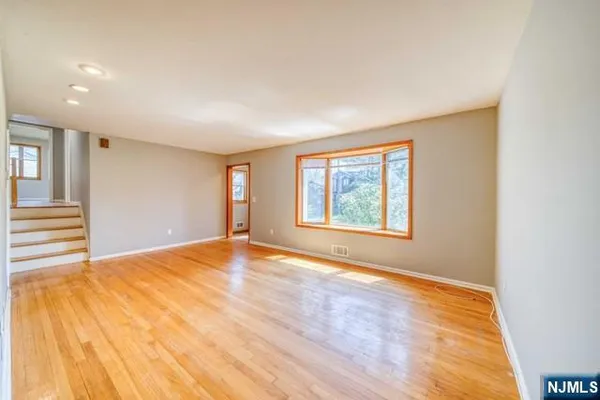 a view of a room that has a large window