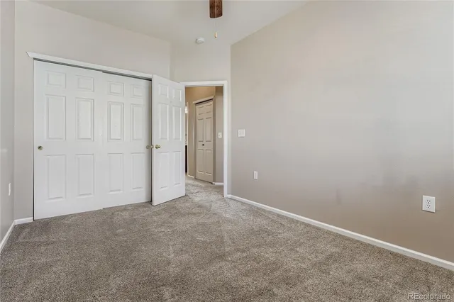 an empty room with closet area